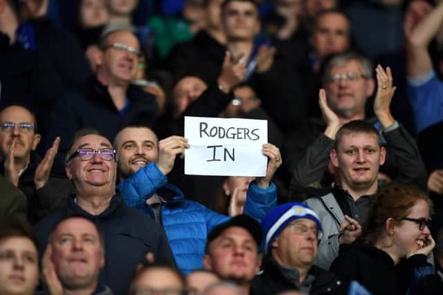 A fan holds a 'Rodgers in' sign prior to the Premier League match between Leicester City and Brighton & Hove Albion at The King Power Stadium. Picture: Getty