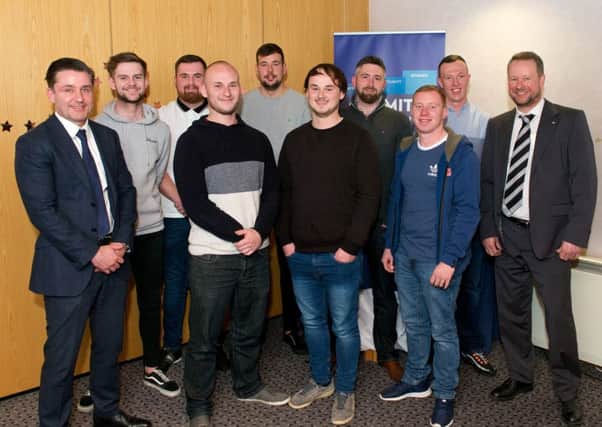 CR Smith managing director Ian Macfarlane (far left) with the firm's apprentices and Frazer Walker, lecturer at Fife College (far right). Picture: Rebecca Lee