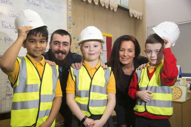 Children are learning about safety on building sites
