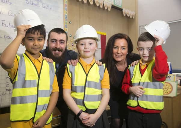Children are learning about safety on building sites