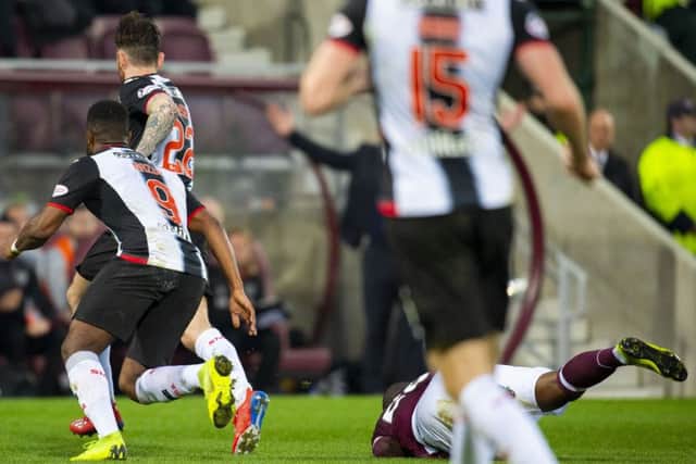 Clevid Dikamona was caught by Greg Tansey at Tynecastle