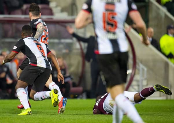 Clevid Dikamona was caught by Greg Tansey at Tynecastle
