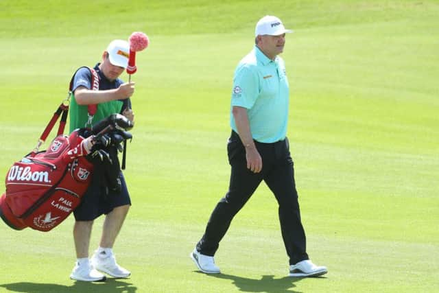 Paul Lawrie has his son Craig caddying for him in Oman. Picture: Warren Little/Getty
