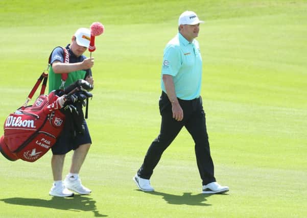Paul Lawrie has his son Craig caddying for him in Oman. Picture: Warren Little/Getty
