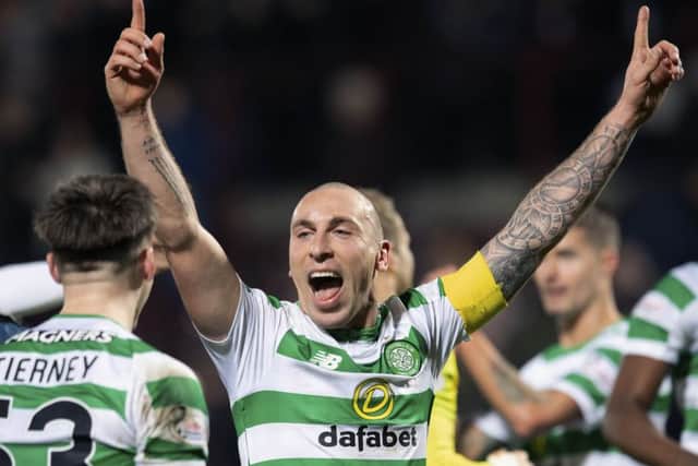 Celtic captain Scott Brown celebrates at full time after the win over Hearts. Picture: SNS
