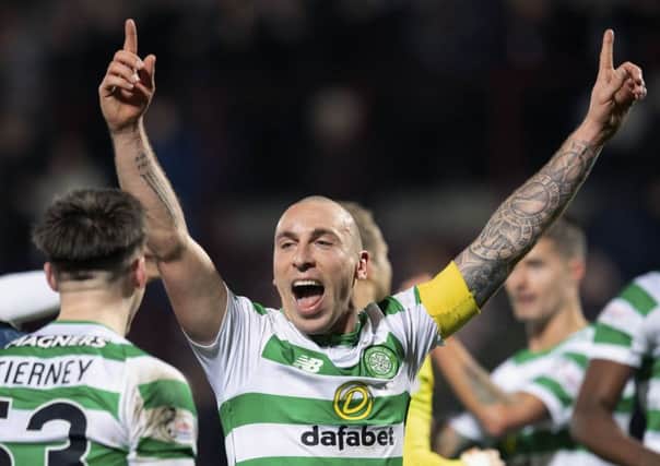 Celtic captain Scott Brown celebrates at full time after the win over Hearts. Picture: SNS