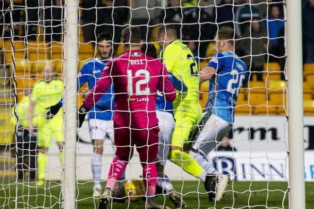 Hibs Florian Kamberi won a penalty for this challenge by Liam Craig. The striker angered Saints' Murray Davidson by his reaction. Picture: SNS.