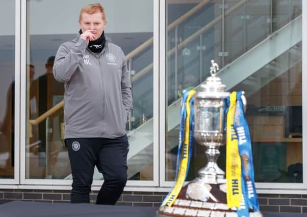 Neil Lennon keeps an on the Scottish Cup. Picture: Steve Welsh