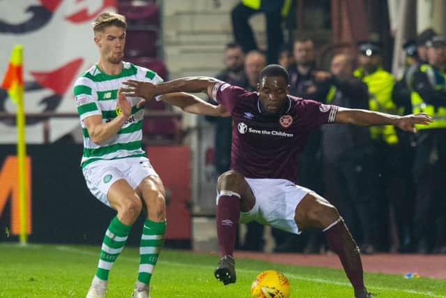 Uche Ikpeazu uses his strength to hold off Celtics Kristoffer Ajer on Wednesday. Picture: SNS.