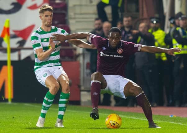 Uche Ikpeazu uses his strength to hold off Celtics Kristoffer Ajer on Wednesday. Picture: SNS.
