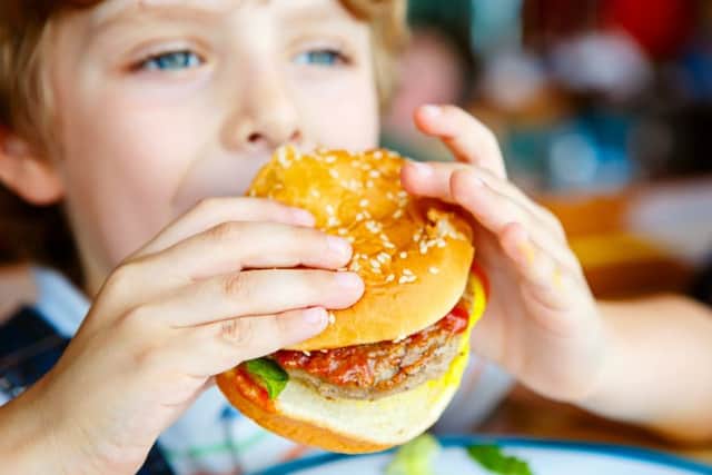 Having a cheeseburger, fries and sugary drink you will consume an extra 454 calories than if you only had a cheeseburger
