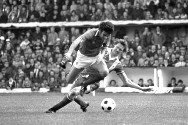 Aberdeen's Doug Rougvie is booked for this 'savaging' of Rangers' Davie Cooper in the 1979 League Cup final. Picture: Allan Milligan