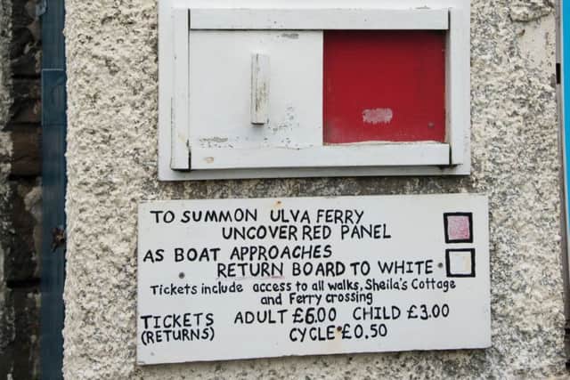 The sign for the ferry, which takes two minutes. Photograph: Rex Features