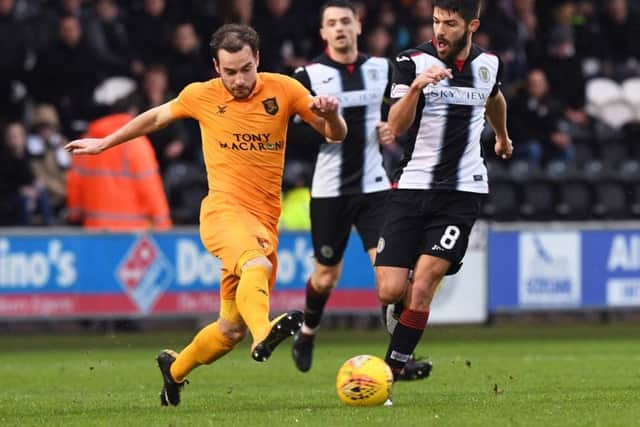Livingston's Scott Pittman battles with St Mirren's Ryan Flynn. Pic: SNS/Paul Devlin