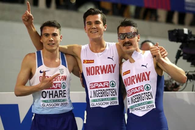 Chris OHare, left, celebrates with Norways Jakob, centre, and Henrik Ingebrigtsen after the 3000m final. Photograph: Jane Barlow/PA Wire