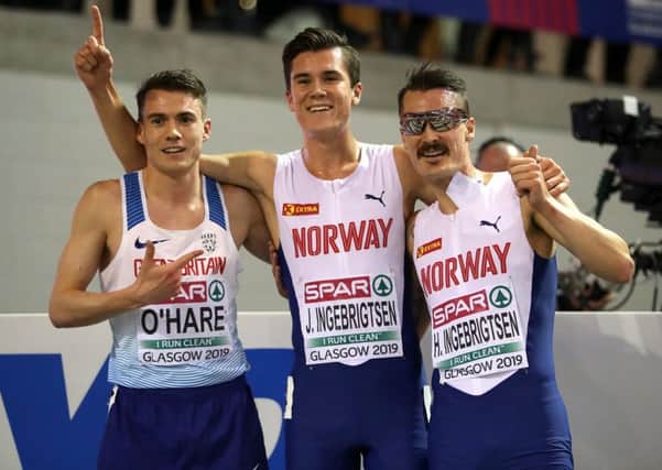 Chris OHare, left, celebrates with Norways Jakob, centre, and Henrik Ingebrigtsen after the 3000m final. Photograph: Jane Barlow/PA Wire