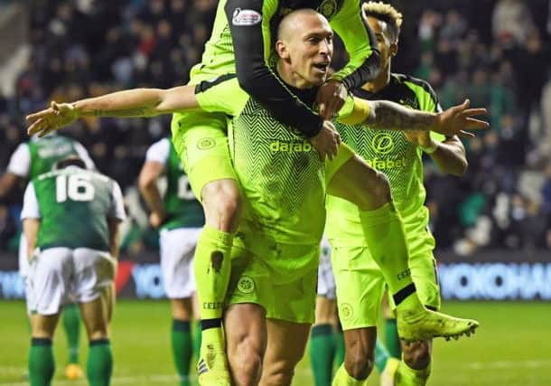 Scott Brown celebrates with Olly Burke after scoring on Saturday. Picture: SNS.