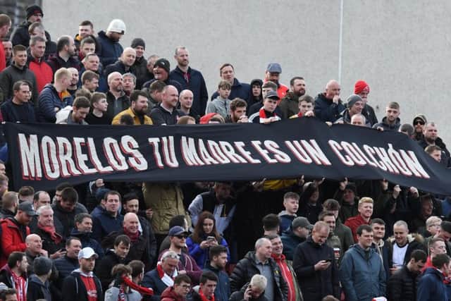 Aberdeen fans have a banner aimed at Rangers' Alfredo Morelos. Picture: SNS