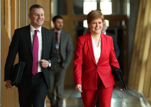 First Minister Nicola Sturgeon and Cabinet Secretary for Finance, Economy and Fair Work Derek Mackay. Picture: Jane Barlow/PA Wire