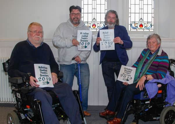 L to R:  Jeff Adamson, Graham Thomson, Eric Johnstone and Marlene Gill with the new directory.
