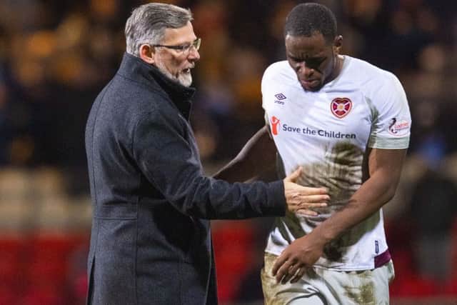 Craig Levein consoles Uche Ikpeazu at the final whistle. Picture: SNS Group