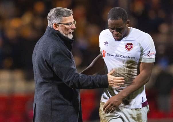 Craig Levein consoles Uche Ikpeazu at the final whistle. Picture: SNS Group