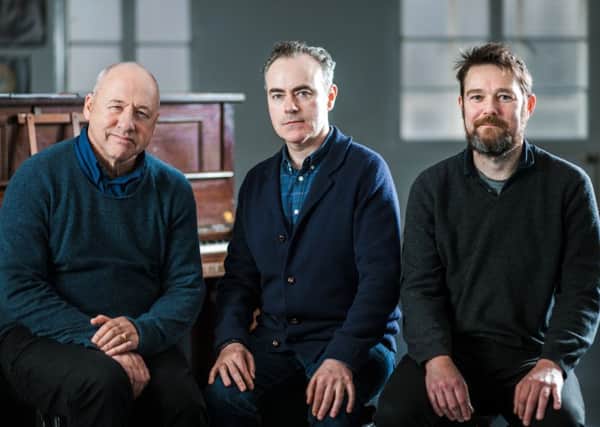 John Crowley, centre, with Mark Knopfler, left, and David Greig