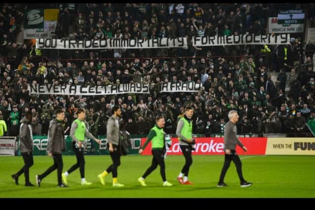Celtic fans hang a banner aimed at former manager Brendan Rodgers the day after he left for Leicester City.