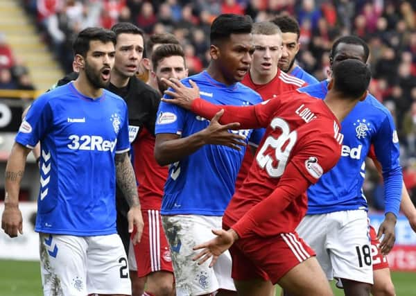 Rangers' Alfredo Morelos clashes with 
Aberdeen's Max Lowe in the Scottish Cup quarter-final at Pittodrie. Picture: SNS