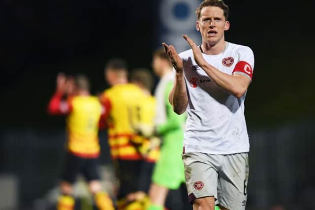 Hearts skipper Christophe Berra applauds the travelling fans after the 1-1 draw with Partick Thistle in the Scottish Cup quarter-final. Picture: SNS