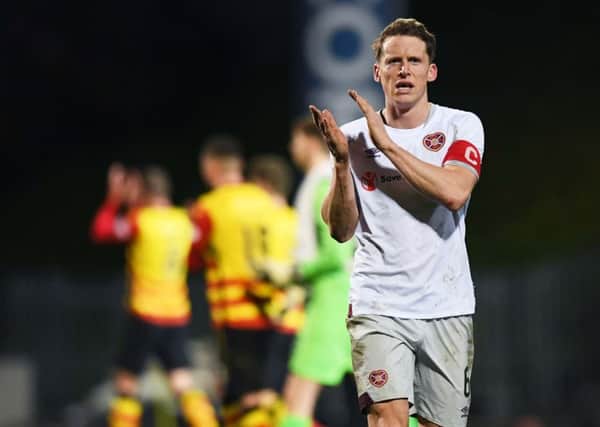 Hearts skipper Christophe Berra applauds the travelling fans after the 1-1 draw with Partick Thistle in the Scottish Cup quarter-final. Picture: SNS