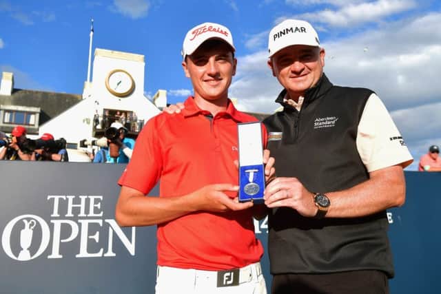 Sam Locke, left, with Paul Lawrie and the silver medal he won at the Open Championship at Carnoustie. Picture: Stuart Franklin/Getty Images