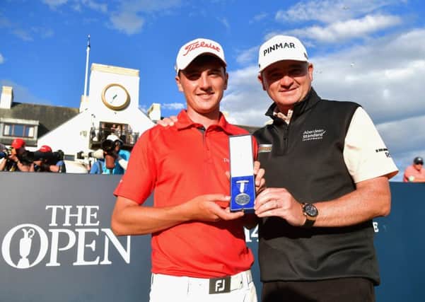Sam Locke, left, with Paul Lawrie and the silver medal he won at the Open Championship at Carnoustie. Picture: Stuart Franklin/Getty Images