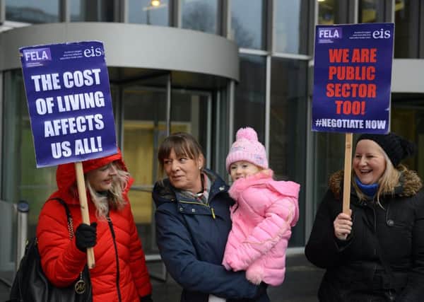 College lecturers and members of the Educational Institute of Scotland (EIS) took part in a one-day strike action over pay outside Glasgow City College and elsewhere. Picture: SWNS