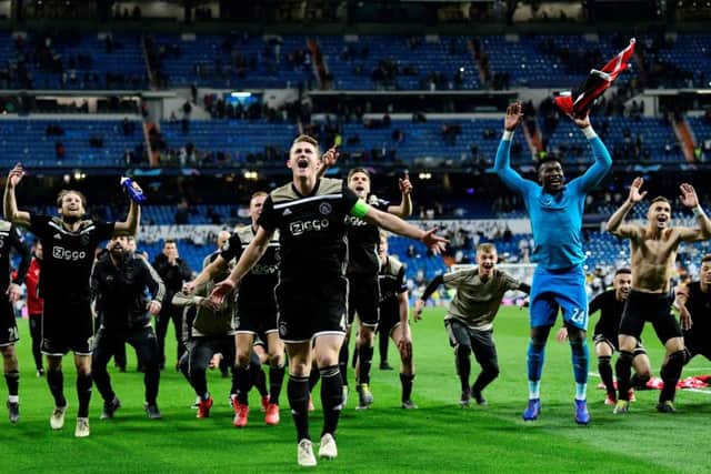 Ajax players celebrate their stunning 4-1 win over Real Madrid at the Bernabeu. Picture: AFP/Getty Images