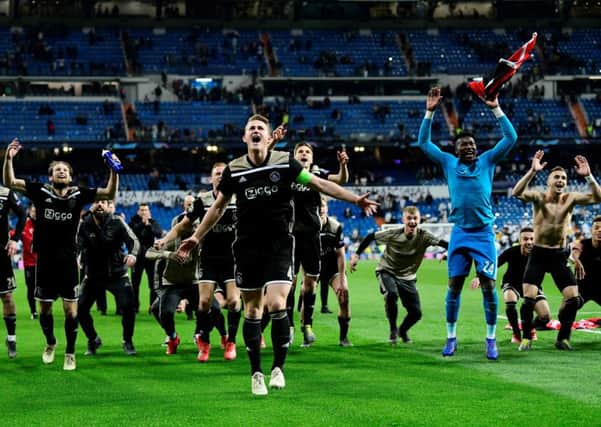 Ajax players celebrate their stunning 4-1 win over Real Madrid at the Bernabeu. Picture: AFP/Getty Images