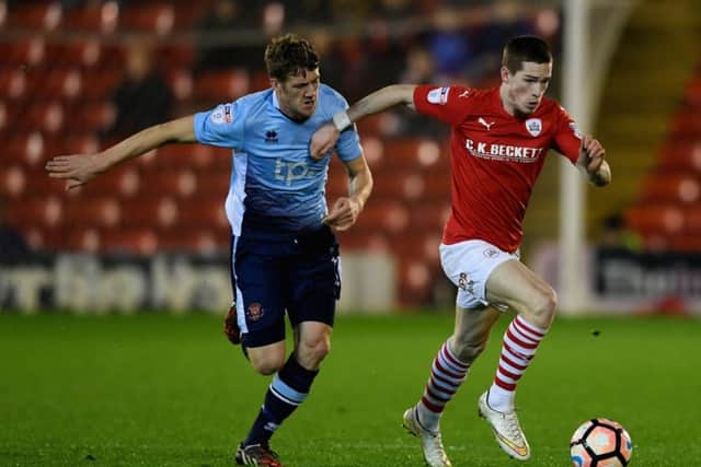 Kent, right, in action for Barnsley against Blackpool's Marc Roberts in January 2017. Picture: Getty Images