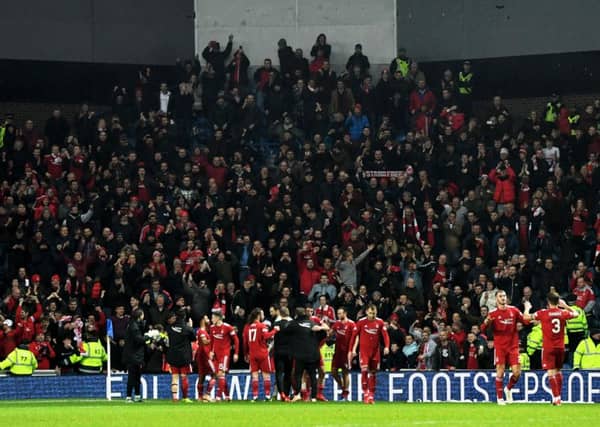 Aberdeen players celebrate with their fans. Picture: SNS/Craig Williamson