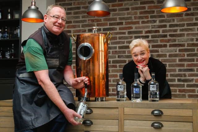 NB Distillery head of production Steve Ross and sales chief Rhona Hartley with the dispenser that will be used to refill customers' bottles. Photograph: Scott Louden