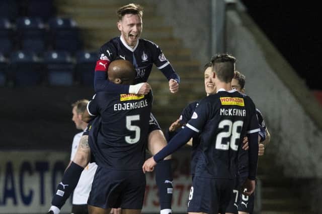 Defender Jordan McGhee celebrates scoring the opener. Picture: SNS.