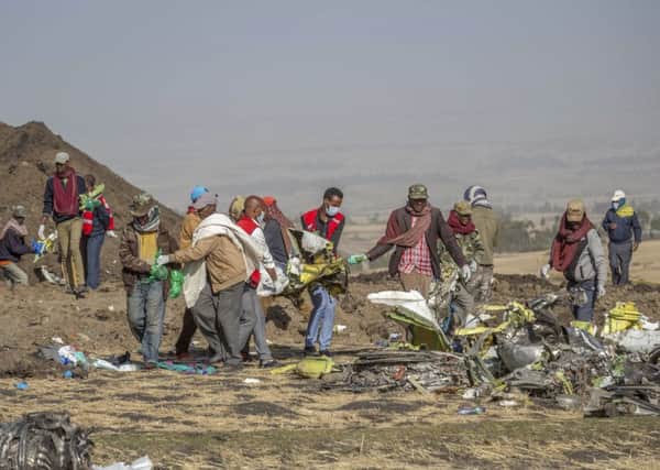 Rescuers work at the scene of an Ethiopian Airlines flight crash south of Addis Ababa,  Ethiopia (Picture: Mulugeta Ayene/AP)
