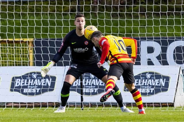 Scott McDonald scores to make it 1-0 to Partick Thistle. Picture: SNS