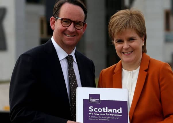 First Minister Nicola Sturgeon receives the Sustainable Growth Commission report from commission chair Andrew Wilson. Picture: Gordon Terris/The Herald/PA Wire