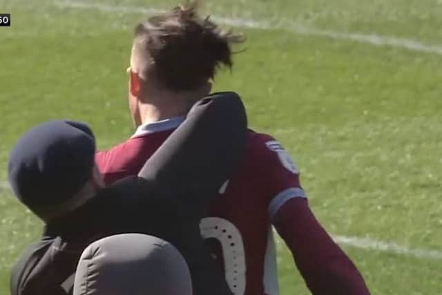 Screengrab taken from Sky Sports Football of a fan attacking Aston Villa's Jack Grealish during the Sky Bet Championship match at St Andrew's Trillion Trophy Stadium, Birmingham. Picture: Sky Sports/PA Wire.