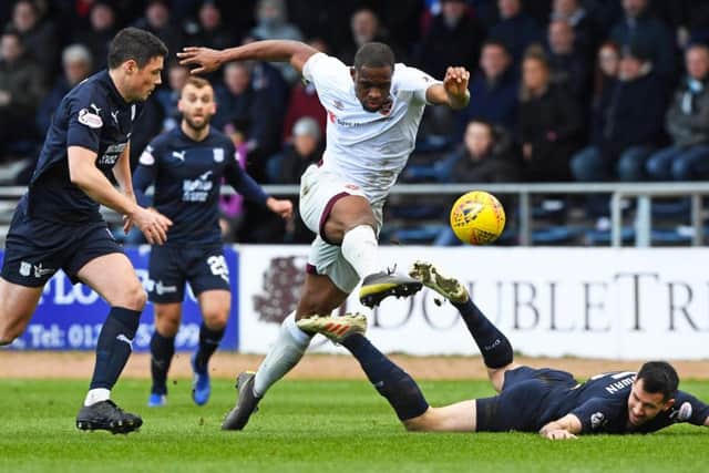 Hearts Uche Ikpeazu powers his way through the Dundee defence during Saturdays 1-0 victory. Picture: SNS.