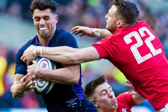 Dan Biggar dives at Adam Hastings during Wales' win over Scotland at BT Murrayfield. Picture: Ross Parker/SNS