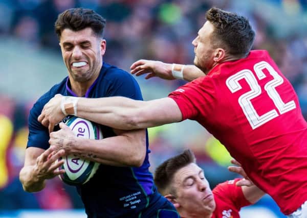 Dan Biggar dives at Adam Hastings during Wales' win over Scotland at BT Murrayfield. Picture: Ross Parker/SNS