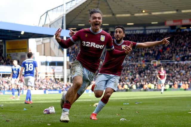 Jack Grealish, who was earlier attacked by a fan, celebrates scoring Aston Villa's winning goal against Birmingham. Picture: Getty.