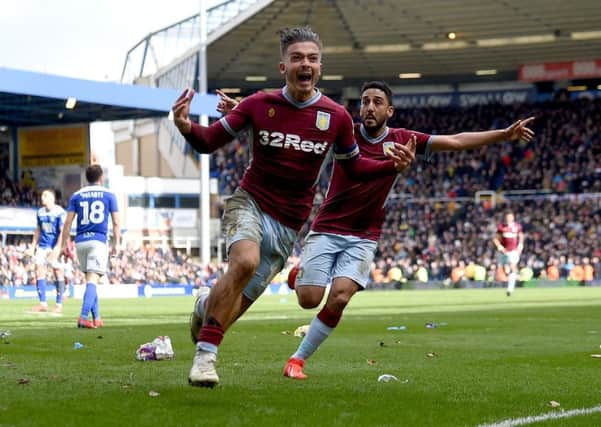 Jack Grealish, who was earlier attacked by a fan, celebrates scoring Aston Villa's winning goal against Birmingham. Picture: Getty.