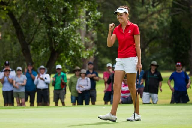 Meghan MacLaren celebrates after finishing with a birdie at Queenbeyan Golf Club, where she finished three shots clear of the field. Picture: Tristan Jones